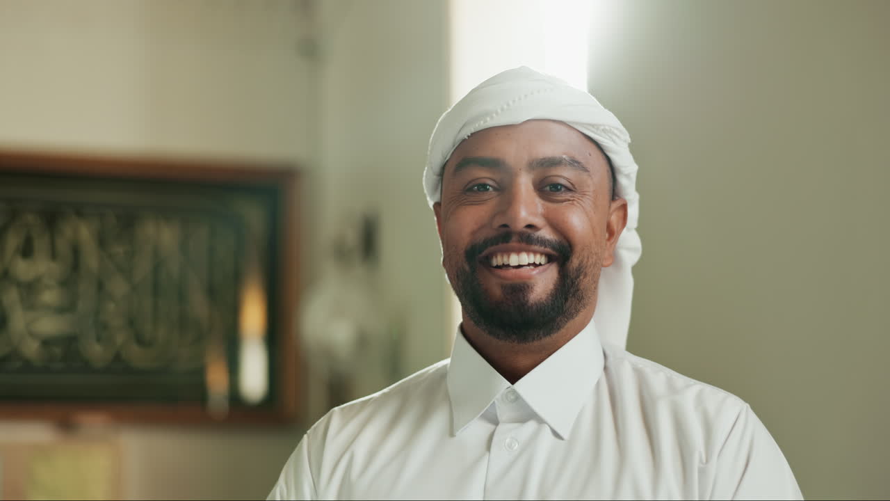 Portrait of a smiling man wearing traditional Arabic clothing