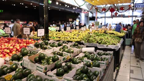 shoppers browse fresh fruits and vegetables