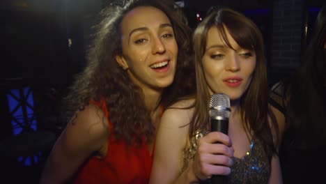 ecstatic multi ethnic friends in nightclub