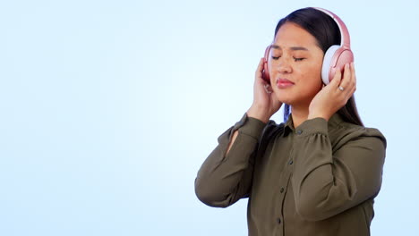 Music,-headphones-and-calm-woman-in-studio