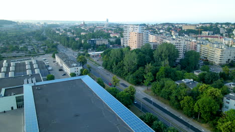 Aerial-push-out-shot-over-rooftop-of-ppnt-building-beside-residential-area-in-Gdynia,Poland