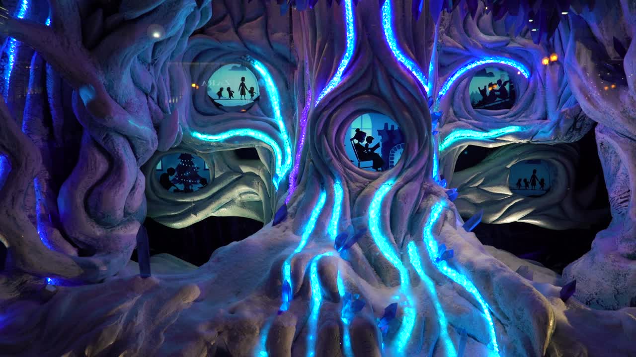 Maltiple Christmas abstract stories made with blue light and silhouette shape on a showcase