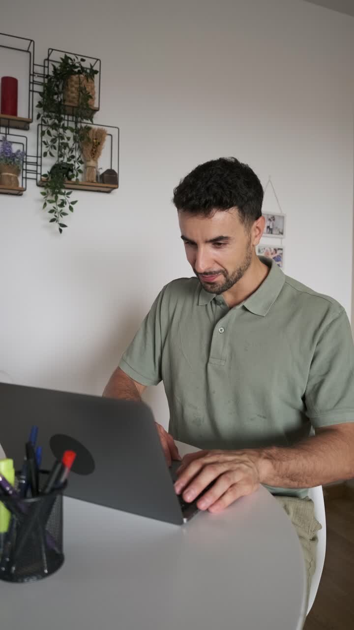 Man working on a laptop at his desk
