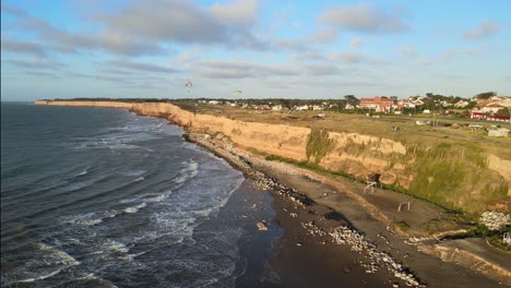 aerial view cliffs beach and paragliding, mar del plata, buenos aires