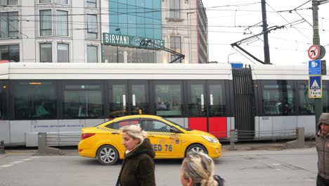 istanbul street scene with tram and people