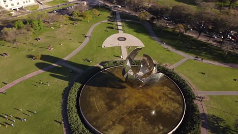 360 degree aerial view of giant stainless steel and aluminum flower, floralis generica in buenos aires, argentina