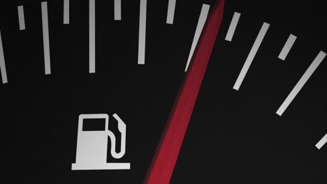 Animation-of-close-up-of-fuel-gauge-moving-over-black-background