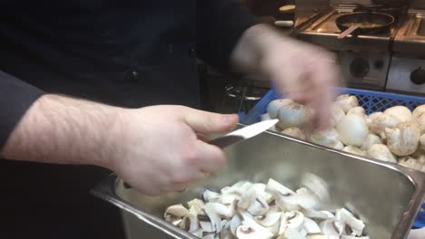 cook cuts mushrooms