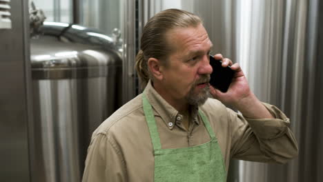 Man-with-long-hair-having-a-call