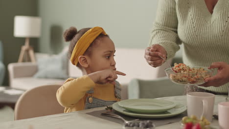 little african girl having lunch