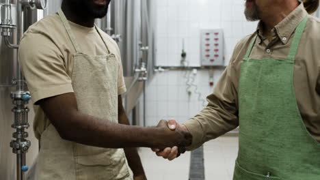 two men talking in the factory