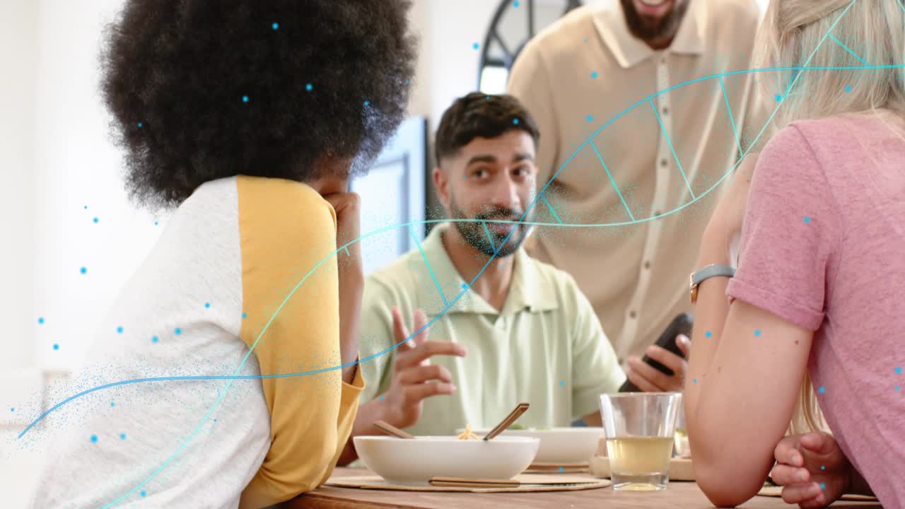 Left woman smiling, watching man bringing phone showing wrist device at table health DNA overlaying