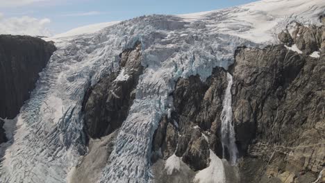 closing up drone footage with melting bruerbreen glacier in folgefonna national park in norway