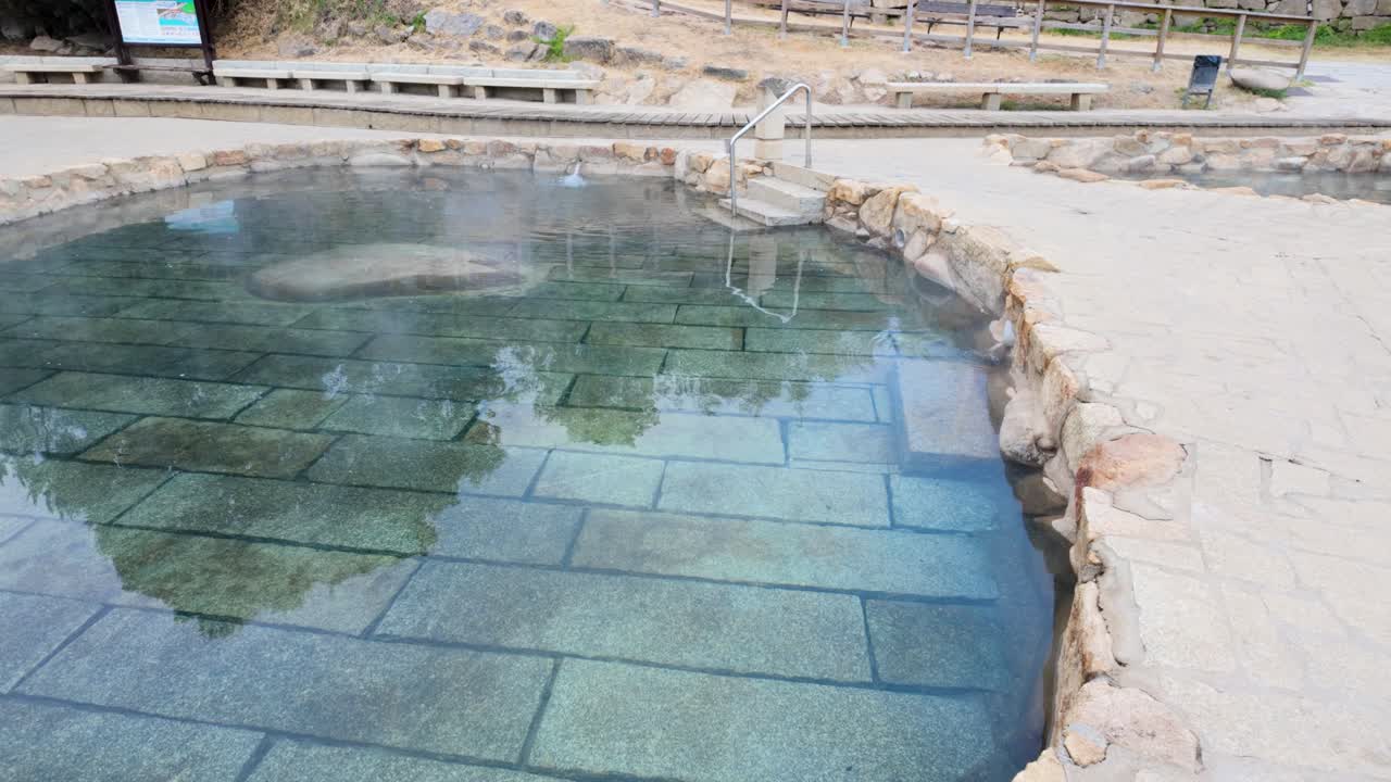Establishing shot of Muiño da Veiga thermal baths in Ourense, Galicia, Spain