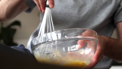 Whisking-egg-dynamic-shot-in-bowl