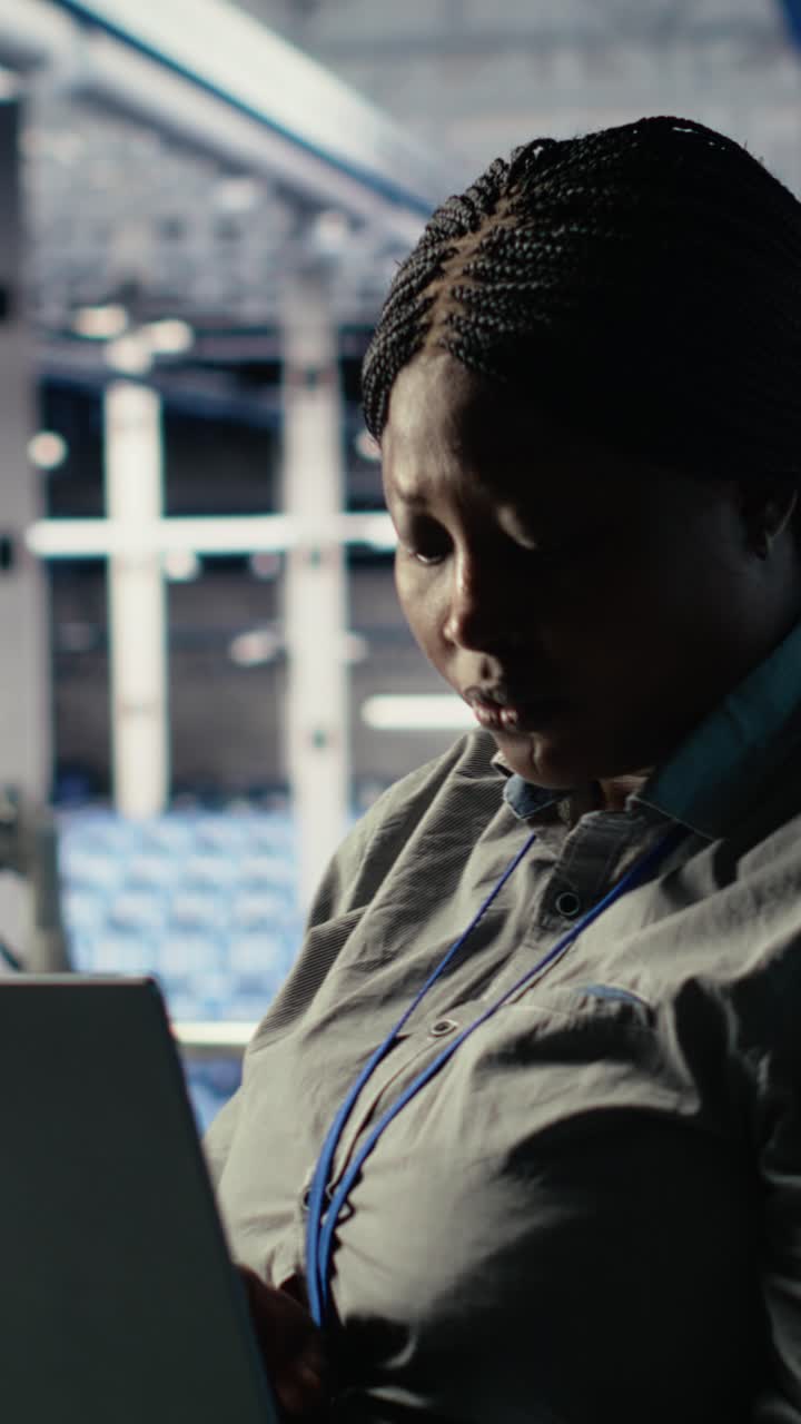 Vertical Video Data Center Admin Checks Ai Dashboard Using Laptop During Rigs Systems Review