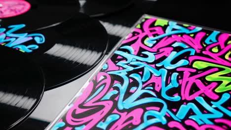 colorful vinyl records with graffiti art