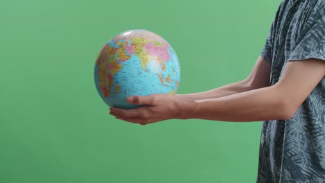 person holding a globe