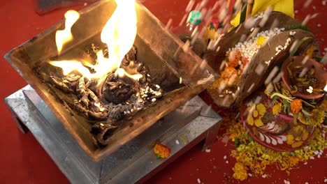 hindu wedding fire or yagna during hindu religious ceremony in india. slow motion shot of a yagna