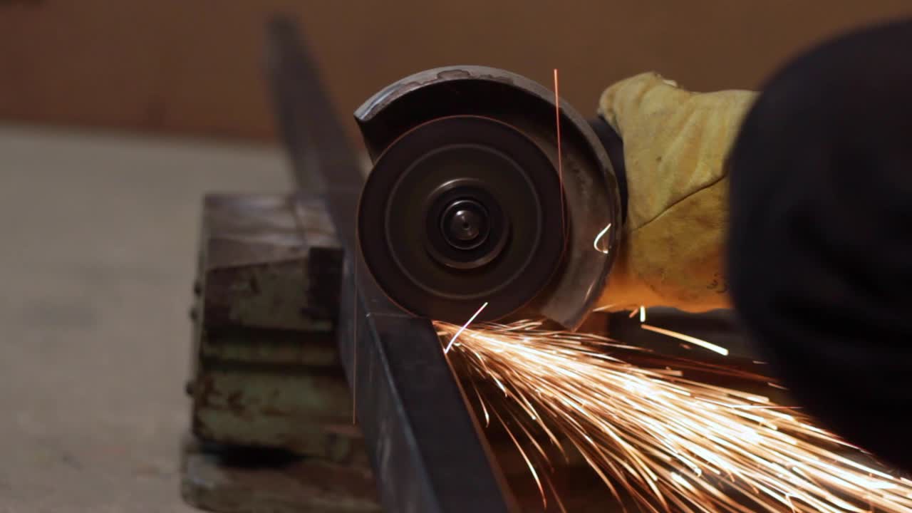 Beautiful fire sparks from a angle grinder cutting metal frame, closeup