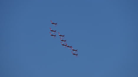 Group-of-sporting-airplanes-flying-at-blue-sky-in-summer,tracking-shot