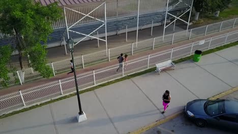 aerial family running on a track