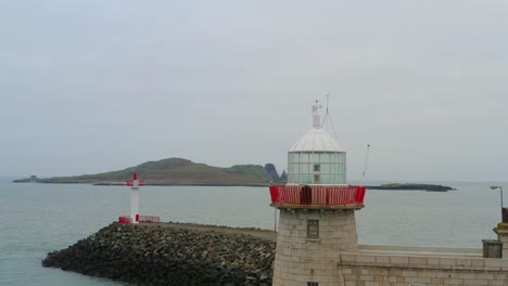 howth lighthouse, aerial pullback, close up to wide