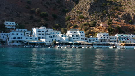 the isolated idyllic port village of loutro in the sfakia region of southern crete, greece - aerial drone shot