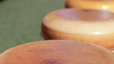 closeup of gouda cheese wheels at the gouda market in the netherlands