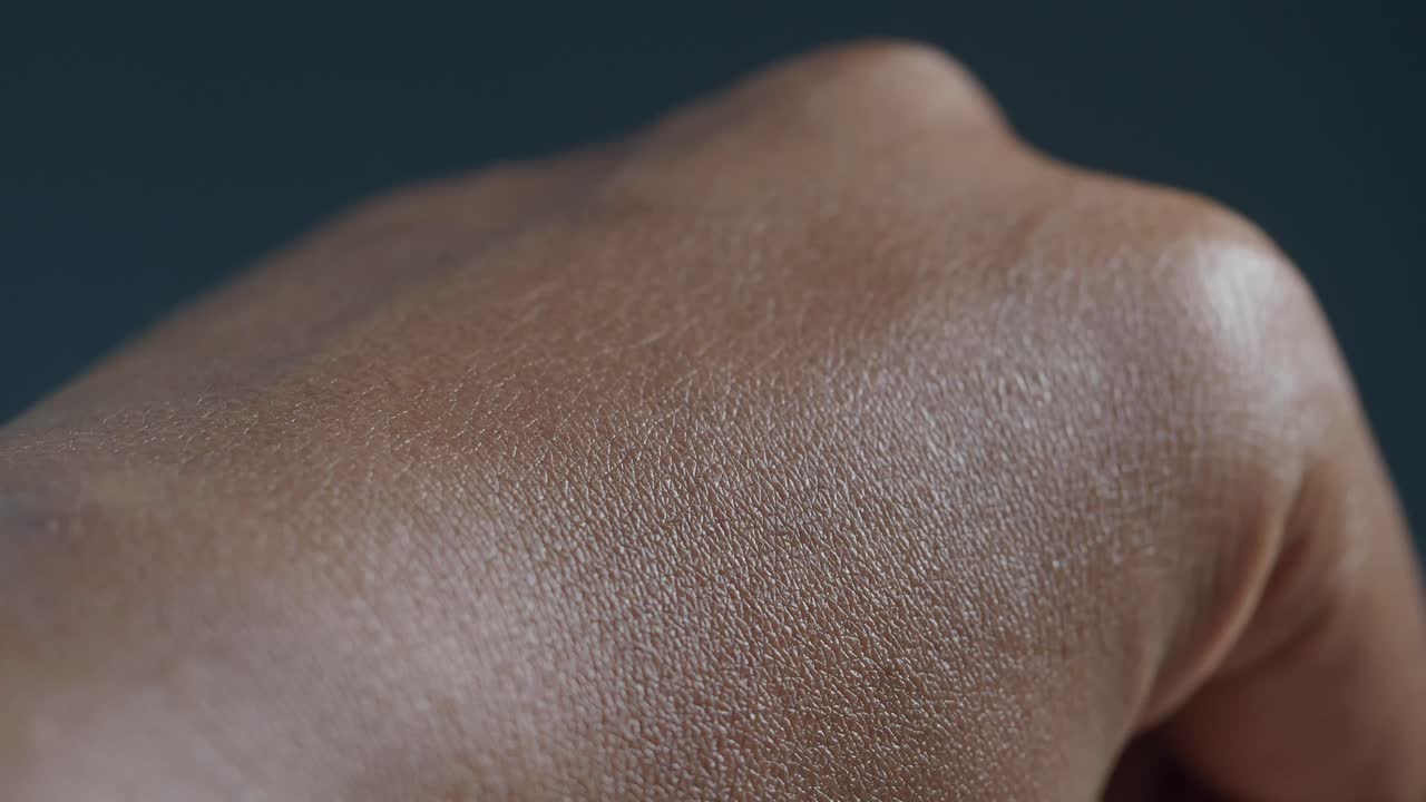 Applying moisturizing cream to a hand