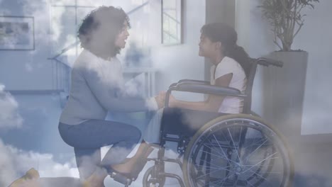 Animation-Von-Wolken-über-Einer-Gemischtrassigen-Mutter-Mit-Tochter-Im-Rollstuhl
