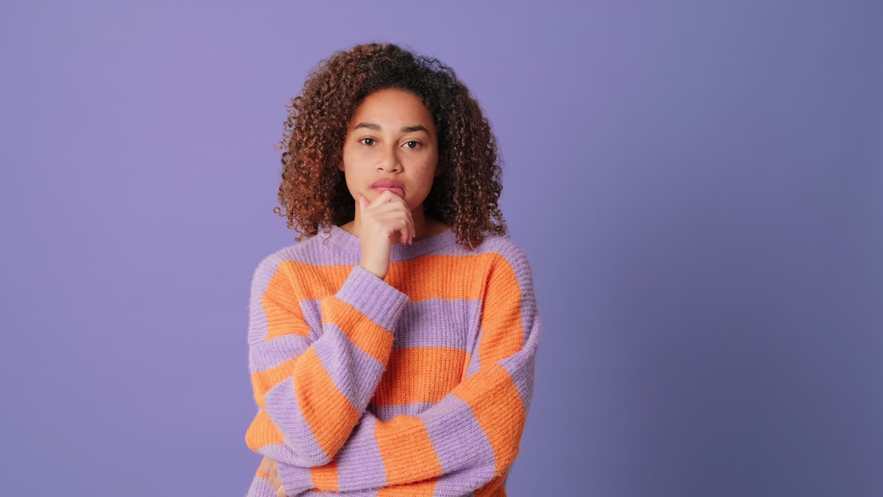 Young Woman Thinking and Expressing Disagreement or Agreement