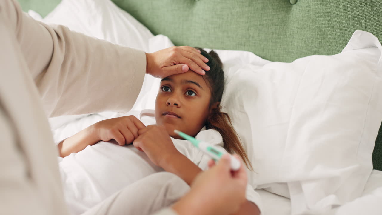 Sick, thermometer and mom care for child with flu