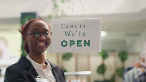 worker opens clothing store