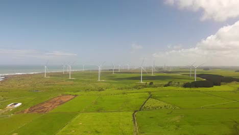 wind turbines fast spinning during high wind on new zealand shore