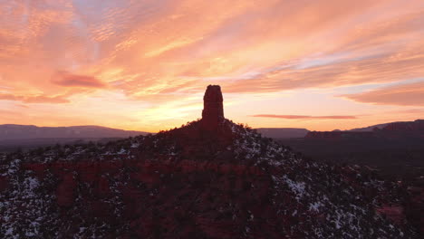 Silhouette-of-Capitol-Butte-in-Arizona's-High-Desert-at-sunset---aerial-parallax-orbit