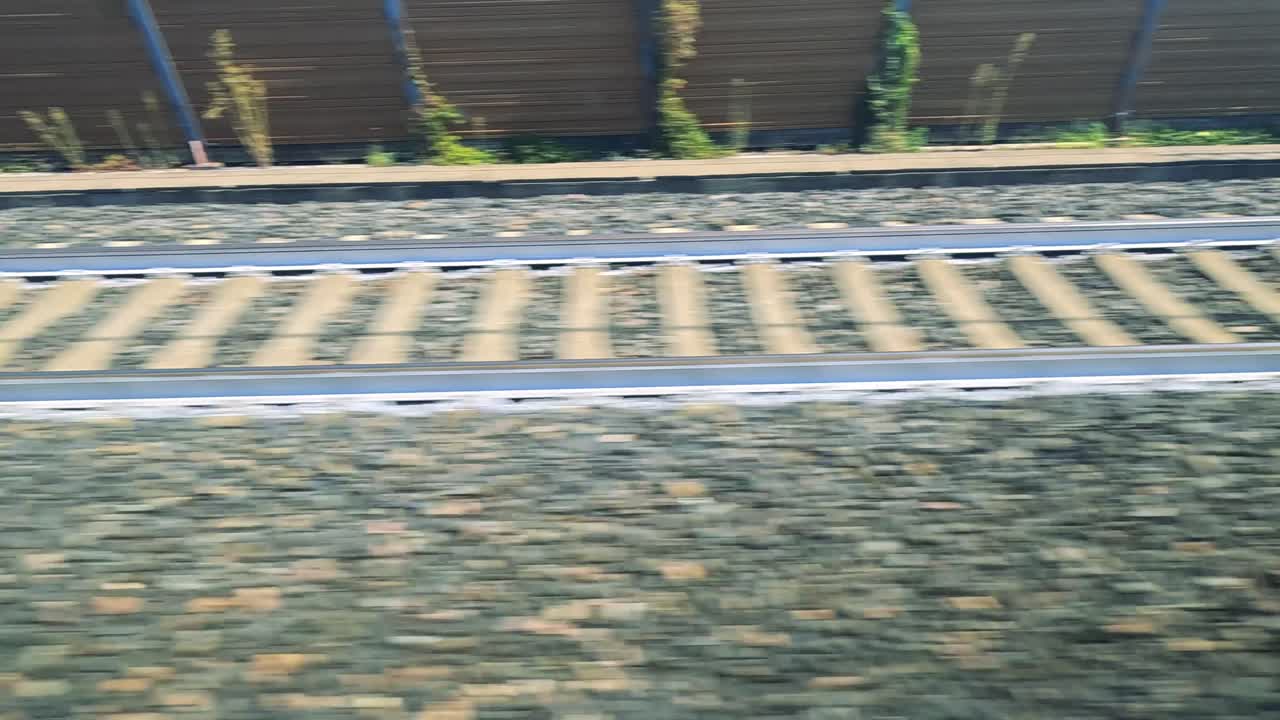 View of railway tracks from moving train