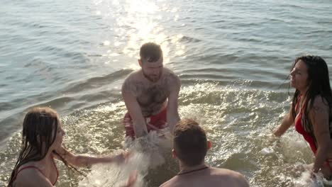 laughing friends having fun in lake