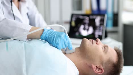 doctor performing an ultrasound examination on a patient's neck