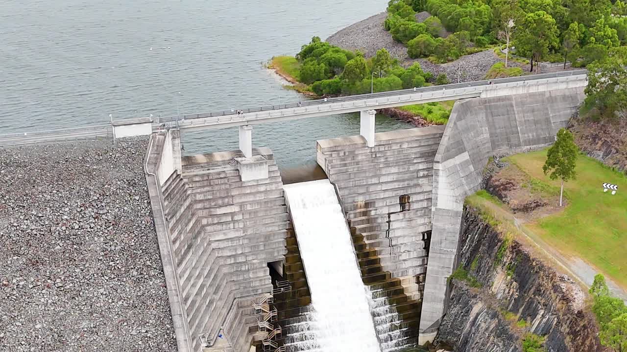 Water cascading over a large dam structure
