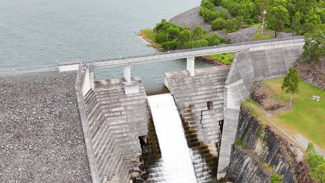 water cascading over a large dam structure