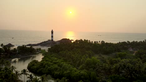 aerial drone shot of the lighthouse overlooking kapu beach in udupi