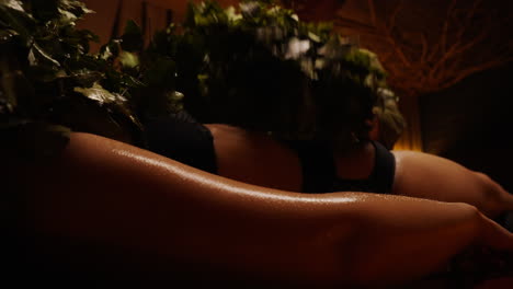 woman receiving herbal banya treatment