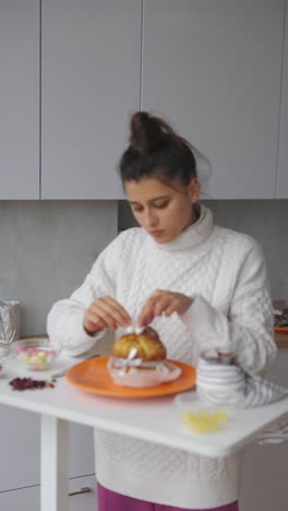 woman decorating a festive easter cake