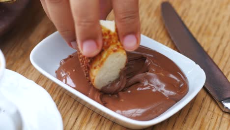 turkish breakfast - simit dipped in chocolate hazelnut spread