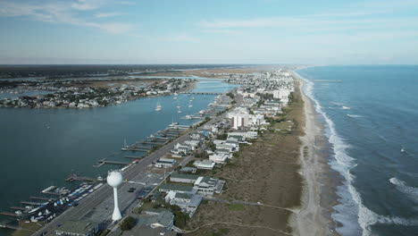 wrightsville beach, north carolina aerial orbiting along shoreline view towards horizon