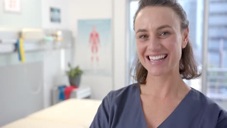 portait of caucasian female physiotherapist smiling at rehab center, copy space