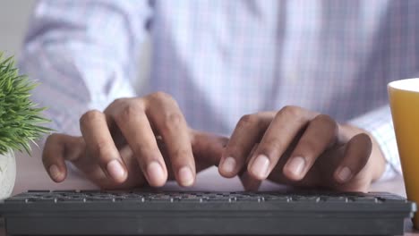 person typing on a keyboard