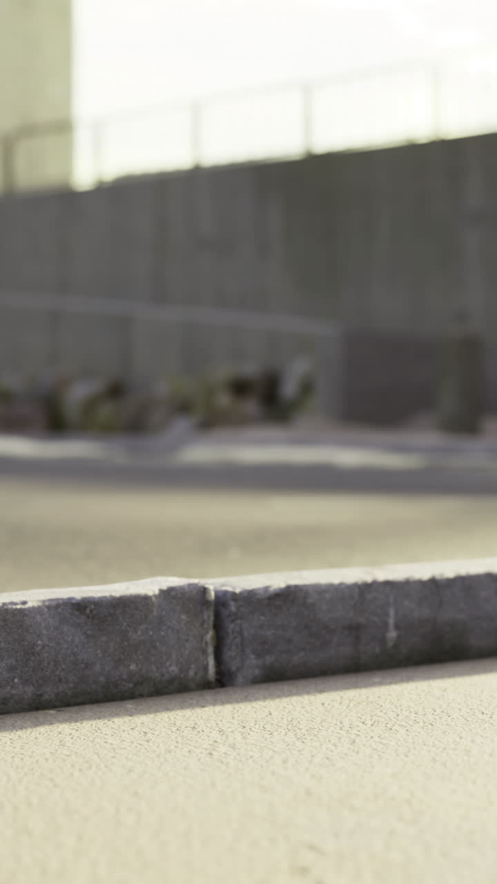 Concrete surface with shadows and distant shapes in an outdoor space