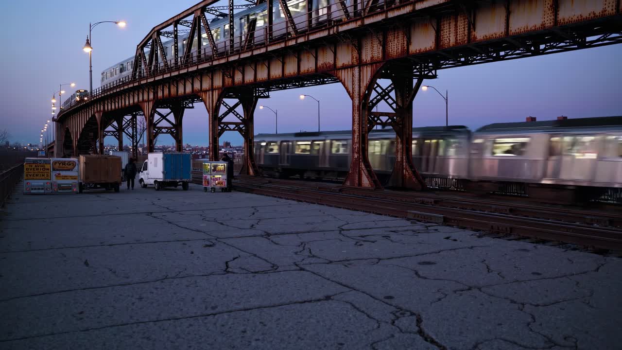 Urban video scene of a rusty bridge at dusk, captured from a low angle